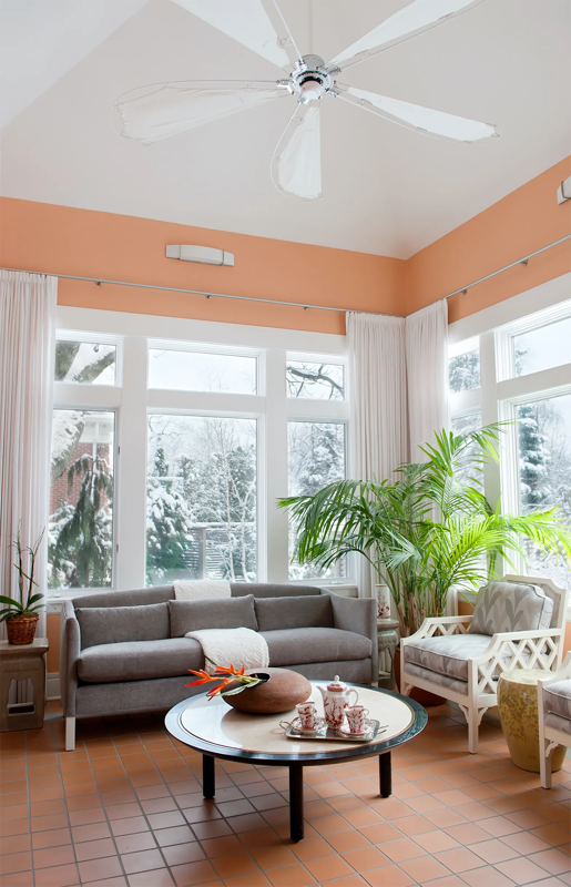 Walls with a pink accent in a well lit sunny living room